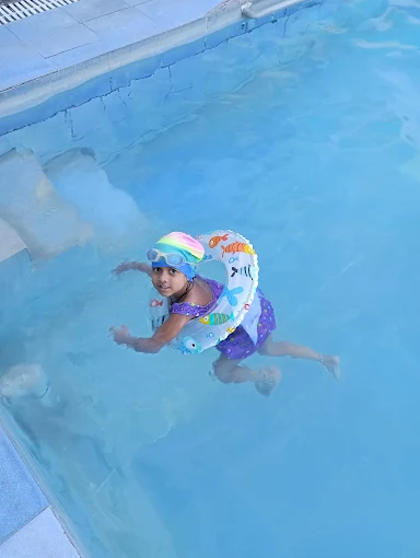 young male professional swimmer in competition swimming pool